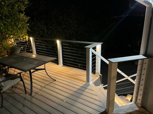Balcony with a railing and a table