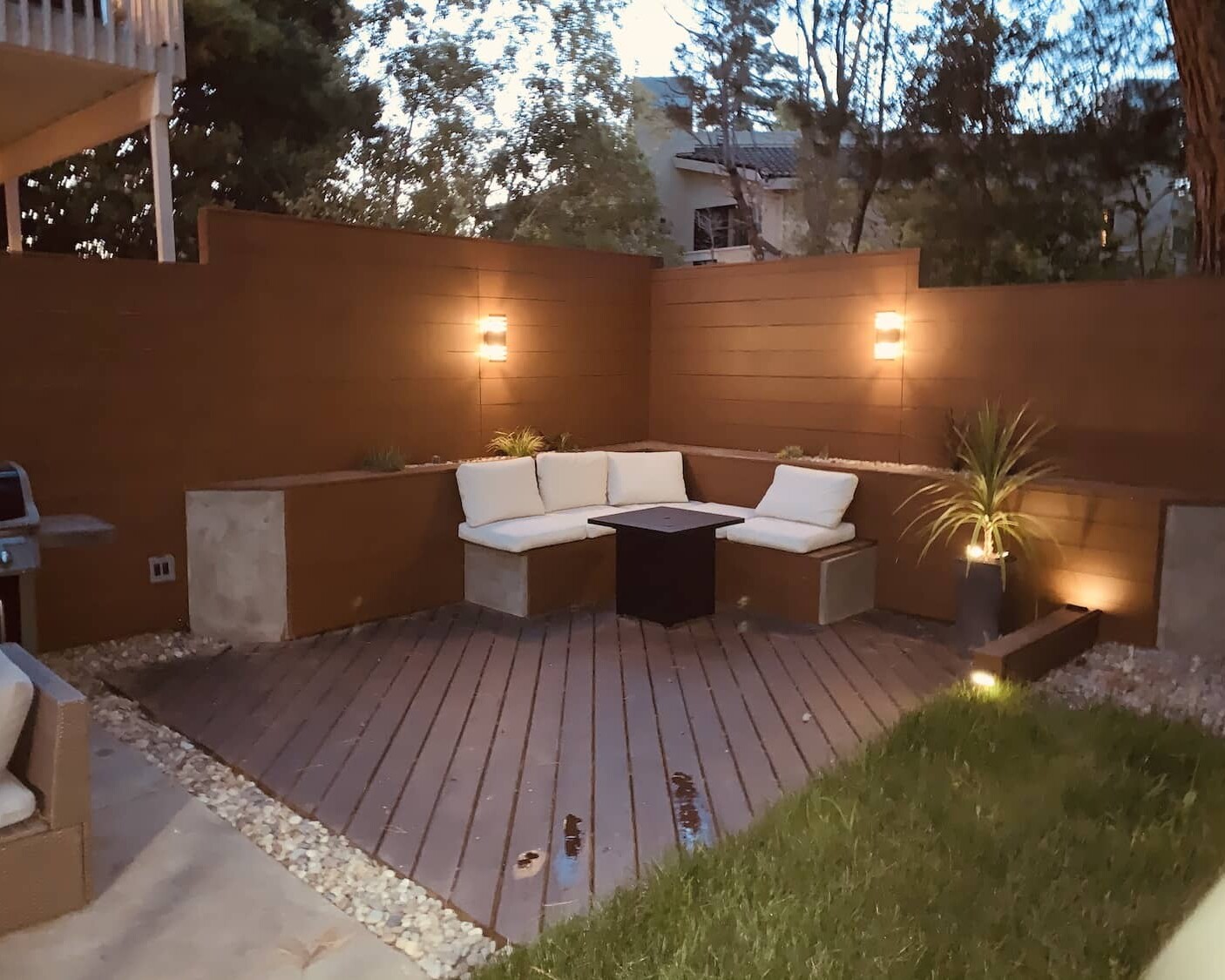 Backyard with lawn, lights, and seating